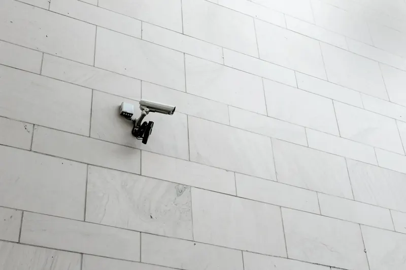 Surveillance camera mounted on a wall
