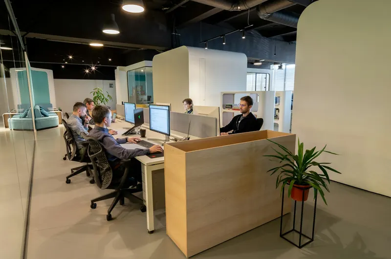 IT support team working at computers in an office