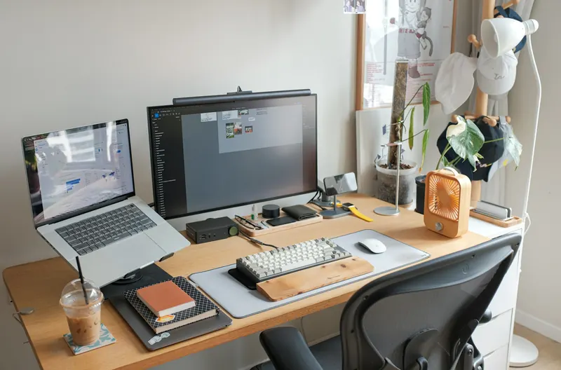 Laptop and desktop monitor on a work desk